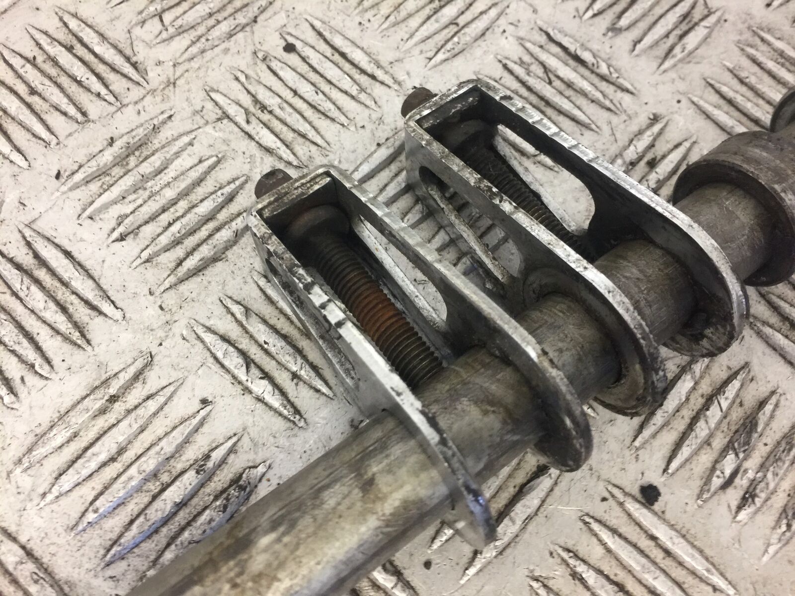 HONDA XL1000 VARADERO REAR WHEEL SPINDLE AND ADJUSTERS YEAR 2002 (STOCK 595)