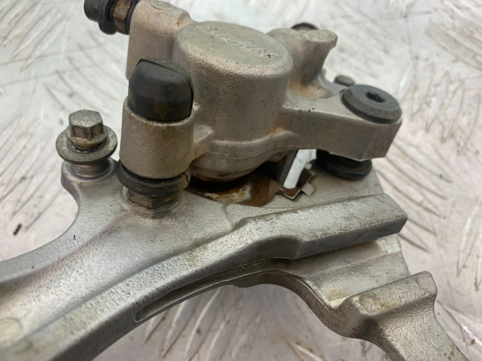 KAWASAKI KXF450 KXF 450 REAR BRAKE CALIPER AND BRACKET  YEAR 2013 CMB1217)