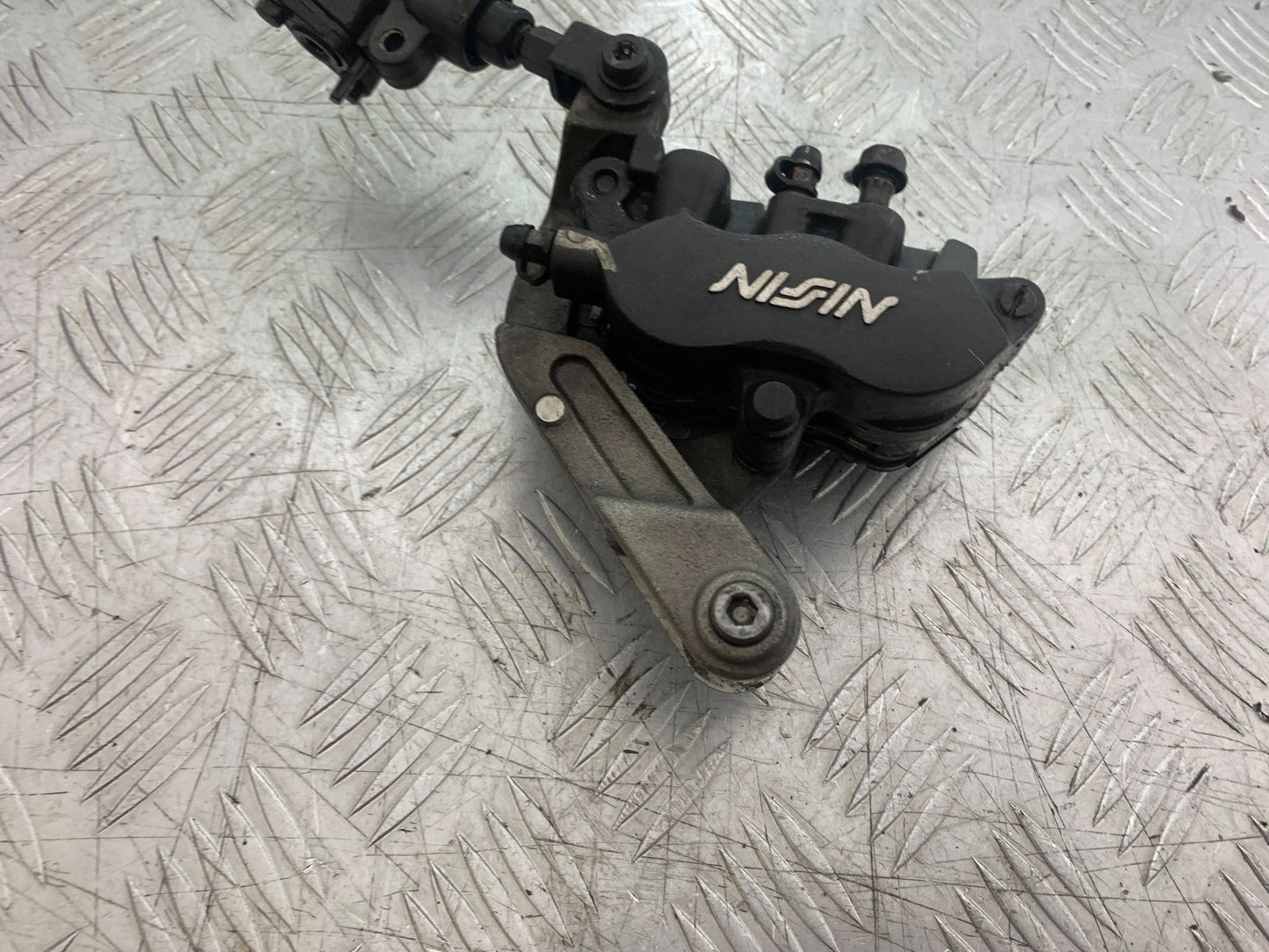 HONDA CBR1100 BLACKBIRD FRONT LEFT CALIPER AND BRACKET  YEAR 1999-2005 (CMB1232)