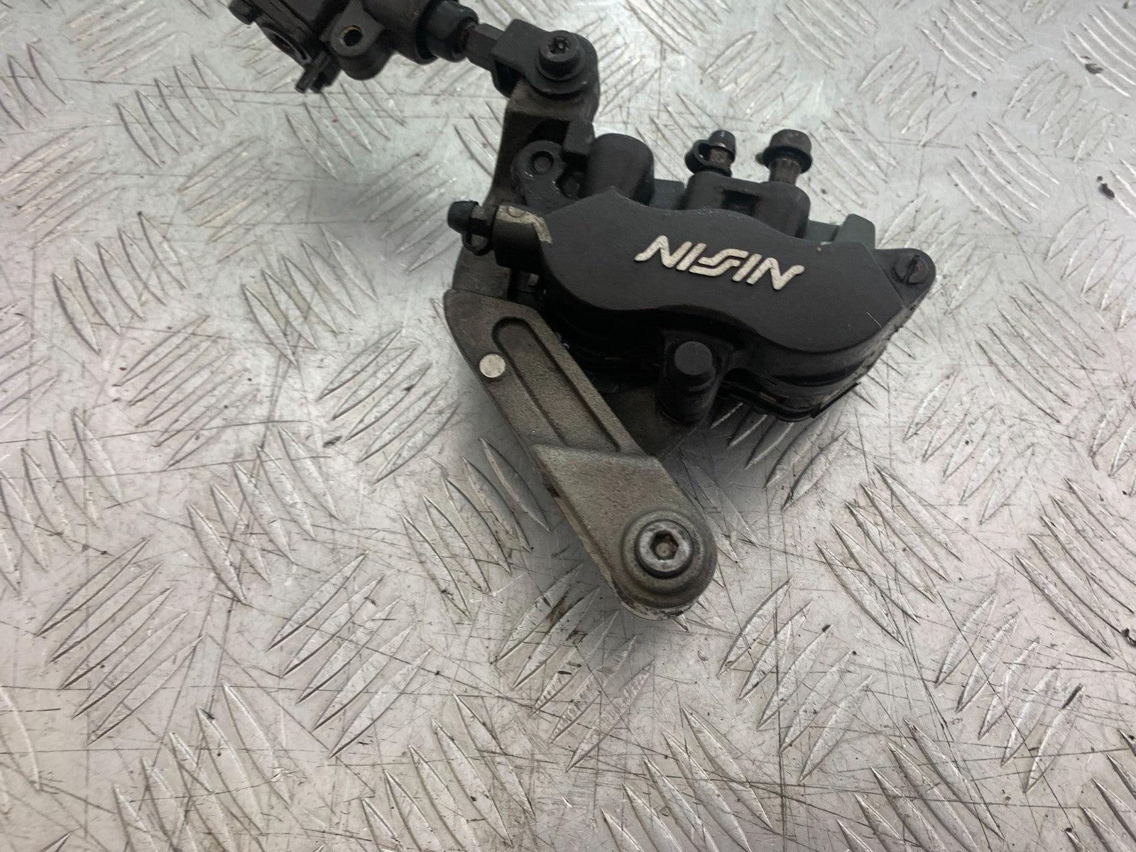HONDA CBR1100 BLACKBIRD FRONT LEFT CALIPER AND BRACKET  YEAR 1999-2005 (CMB1232)