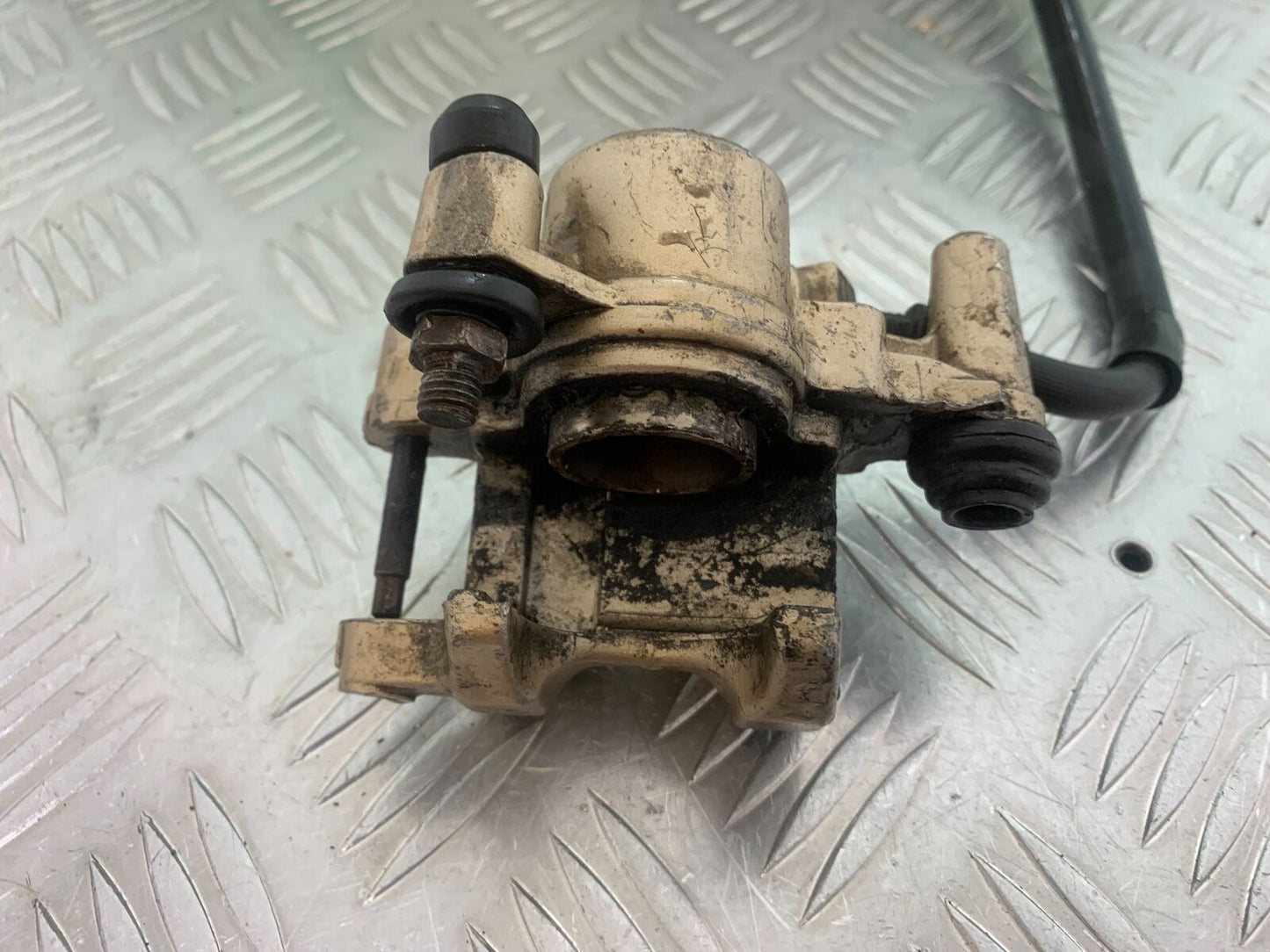 HONDA CBR125 CBR 125 REAR CALIPER  (SOLD AS PARTS ) YEAR 2004-06  (CMB1040)