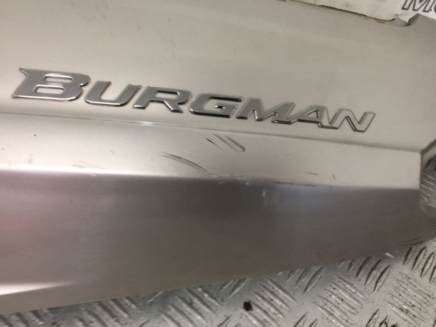 SUZUKI AN 250 BURGMAN LEFT SEAT PANEL YEAR 1999  (STOCK 881)