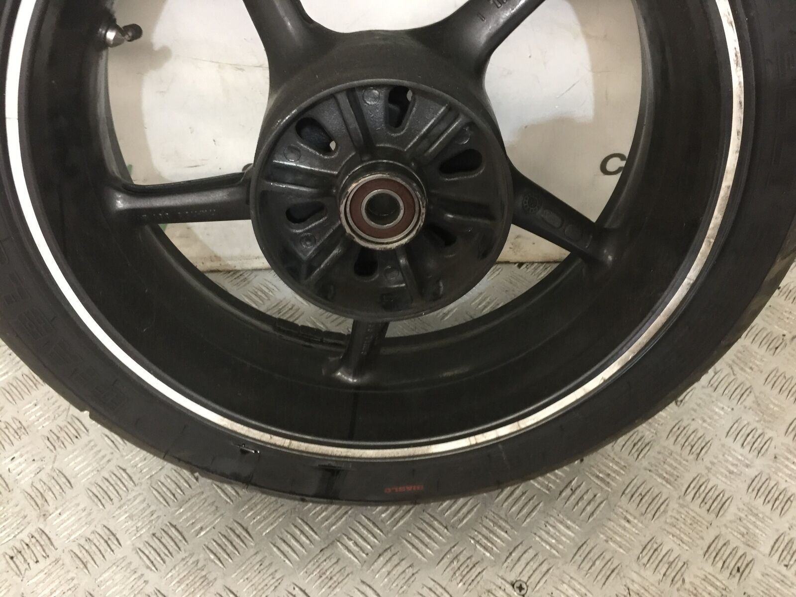 TRIUMPH 675 STREET TRIPLE R REAR WHEEL  YEAR 2012 (STOCK 849)