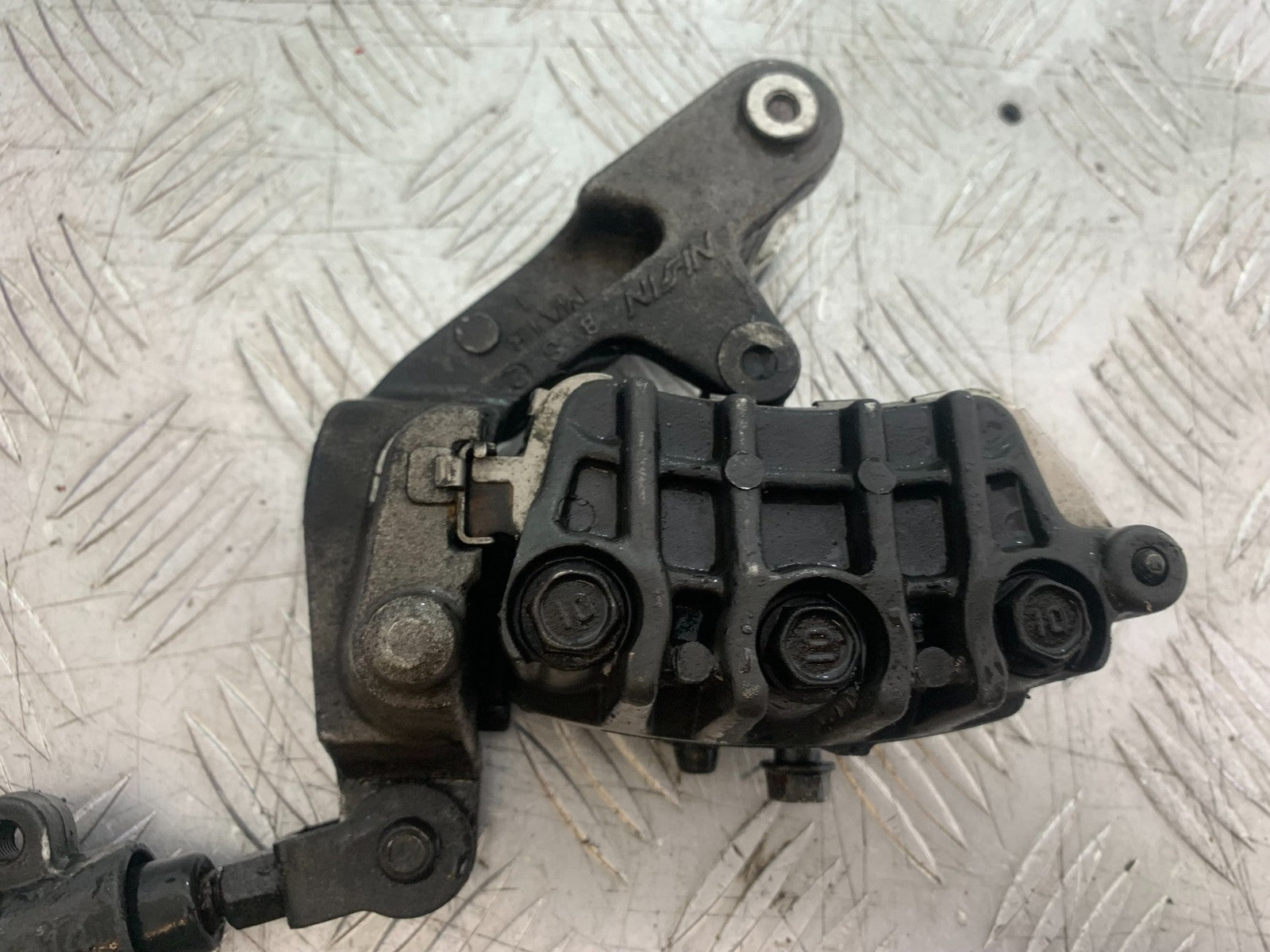 HONDA CBR1100 BLACKBIRD FRONT LEFT CALIPER AND BRACKET  YEAR 1999-2005 (CMB1232)
