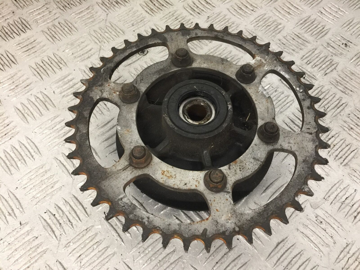 KAWASAKI NINJA 250 R EX250 REAR SPROCKET CARRIER YEAR 2008  (STOCK 879)