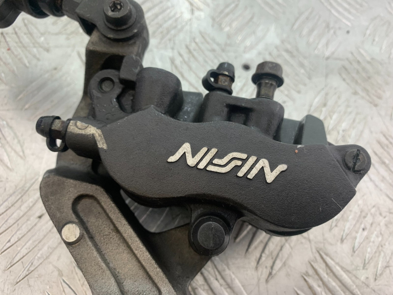 HONDA CBR1100 BLACKBIRD FRONT LEFT CALIPER AND BRACKET  YEAR 1999-2005 (CMB1232)