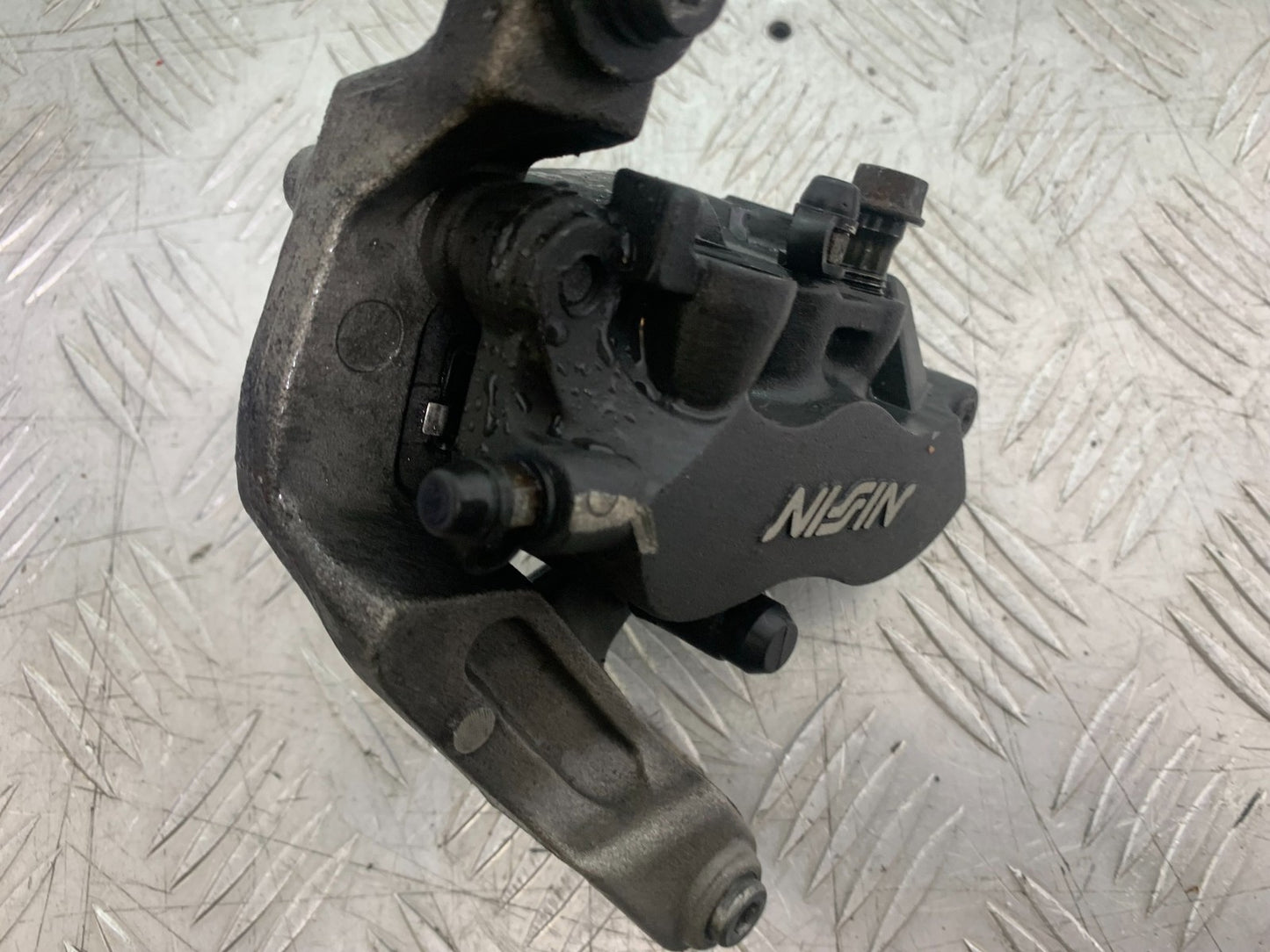 HONDA CBR1100 BLACKBIRD FRONT LEFT CALIPER AND BRACKET  YEAR 1999-2005 (CMB1232)