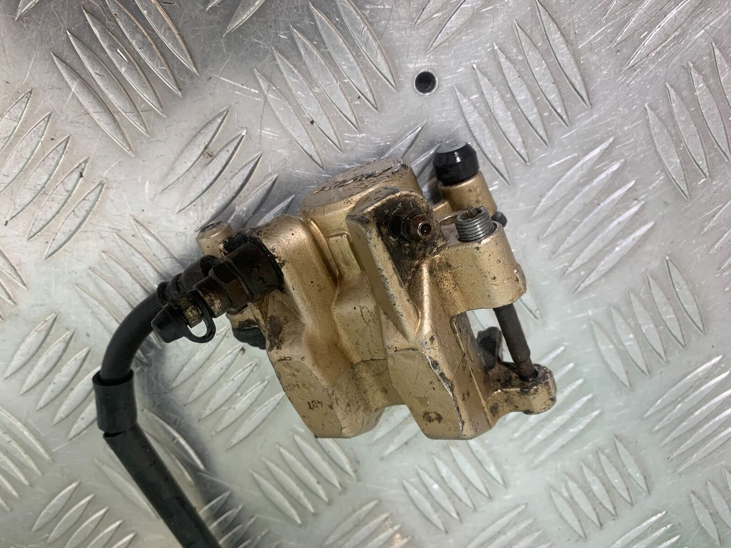 HONDA CBR125 CBR 125 REAR CALIPER  (SOLD AS PARTS ) YEAR 2004-06  (CMB1040)